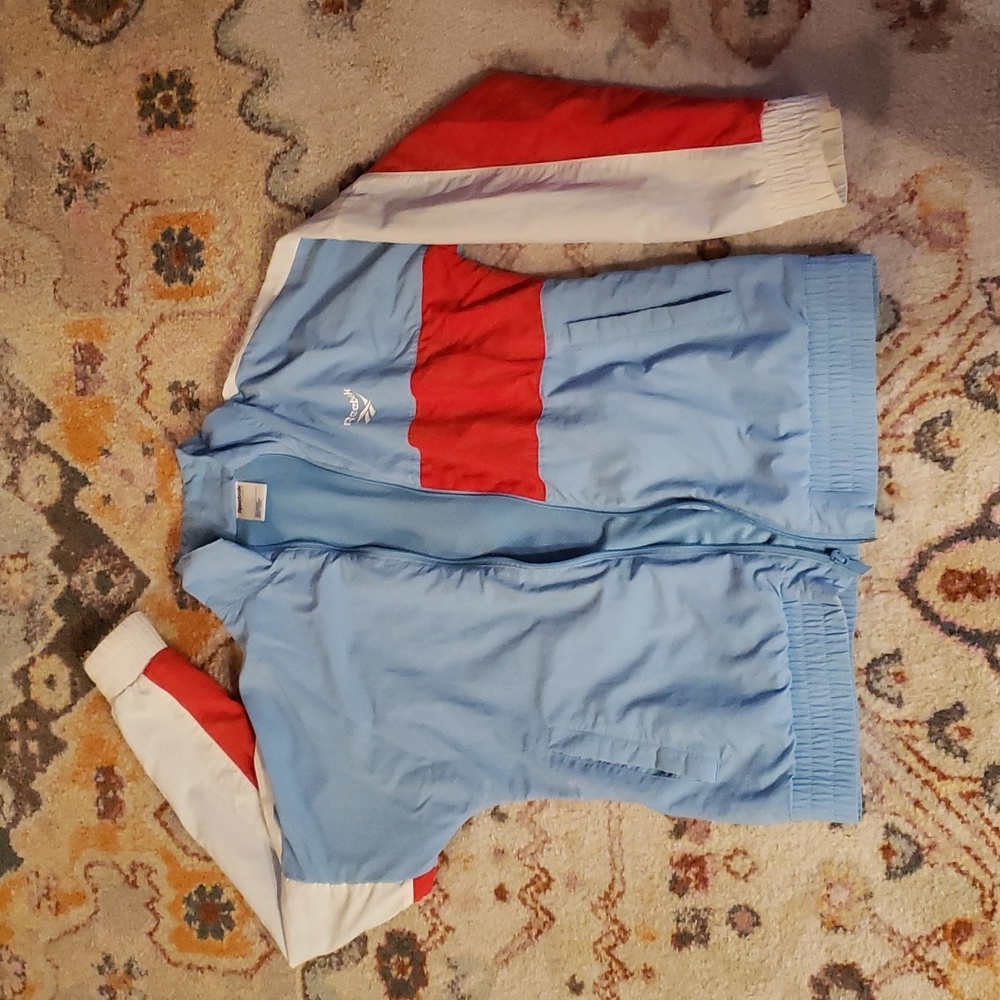 Baby blue Reebok windbreaker